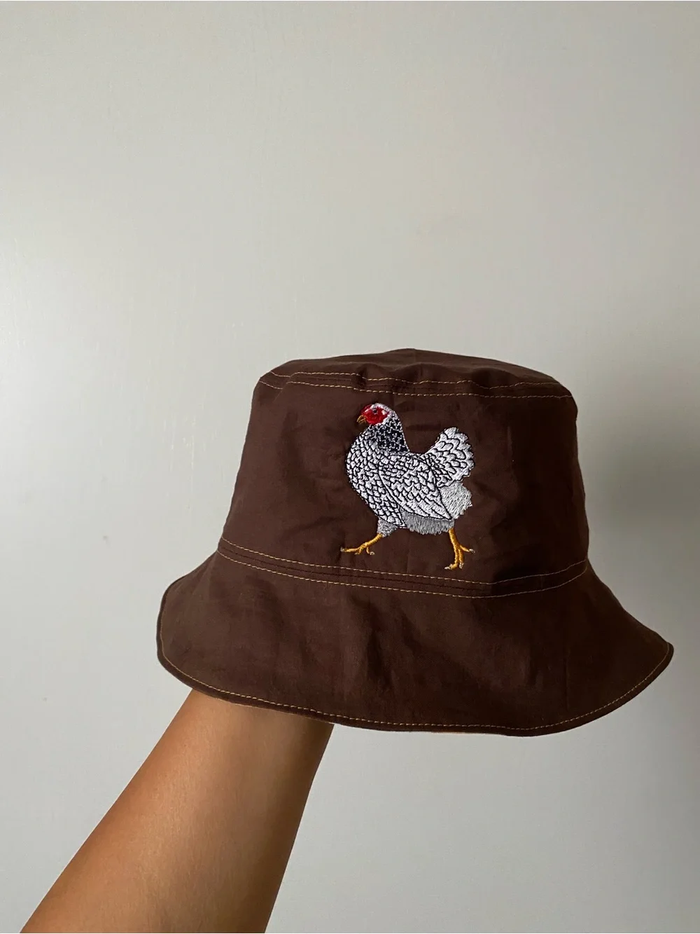 Embroidered Holland Chicken reversible bucket hat.